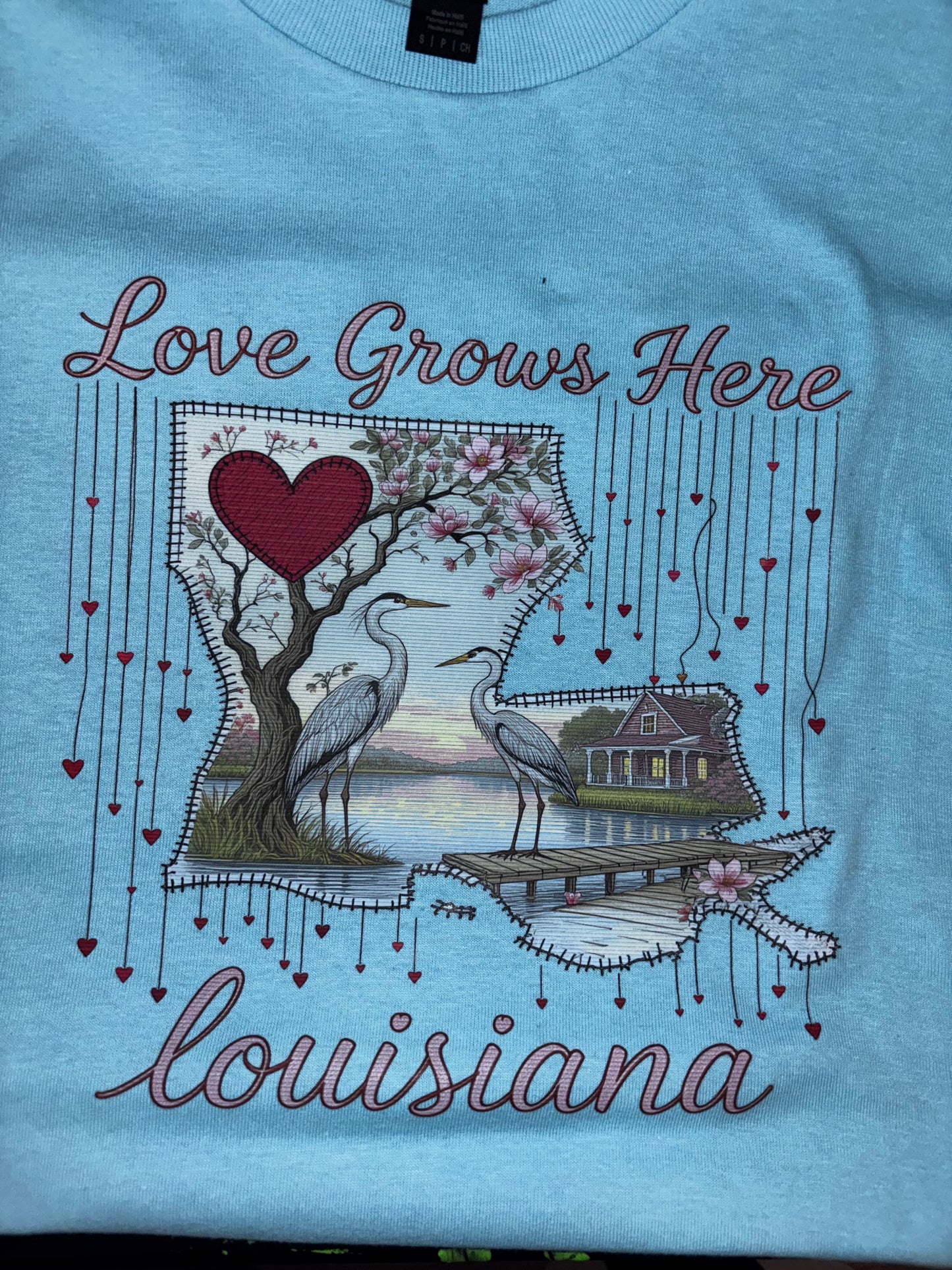 Love Grows Here T-Shirts